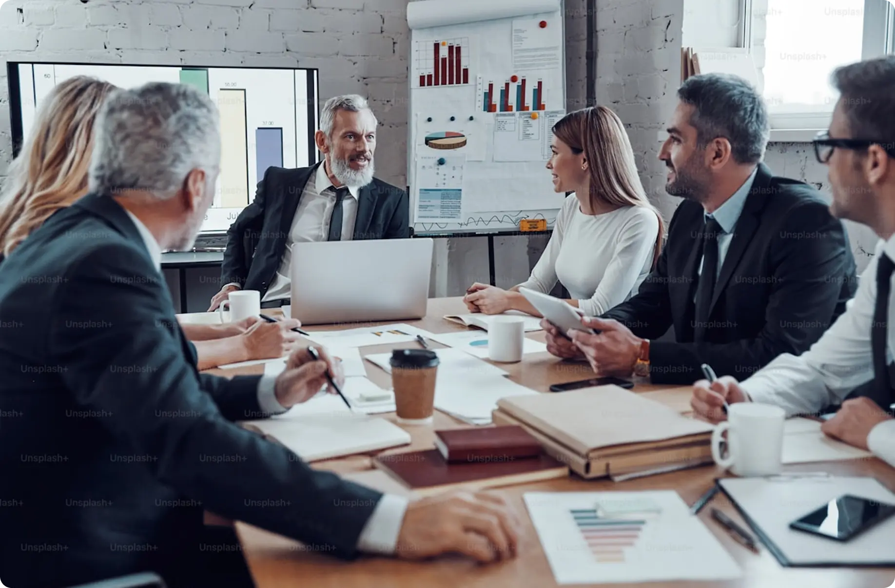 Team reviewing contracts for legal and regulatory compliance